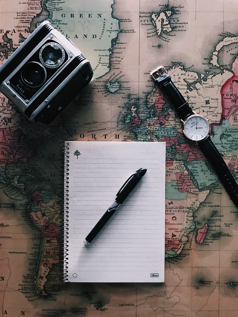 travel planning map notebook camera