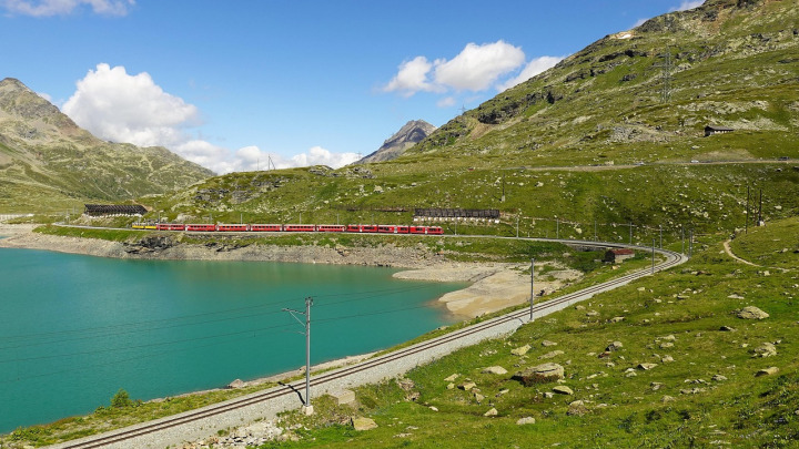train mountains lake